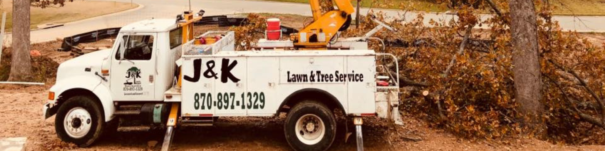 J&K Lawn & Tree service truck at tree removal site